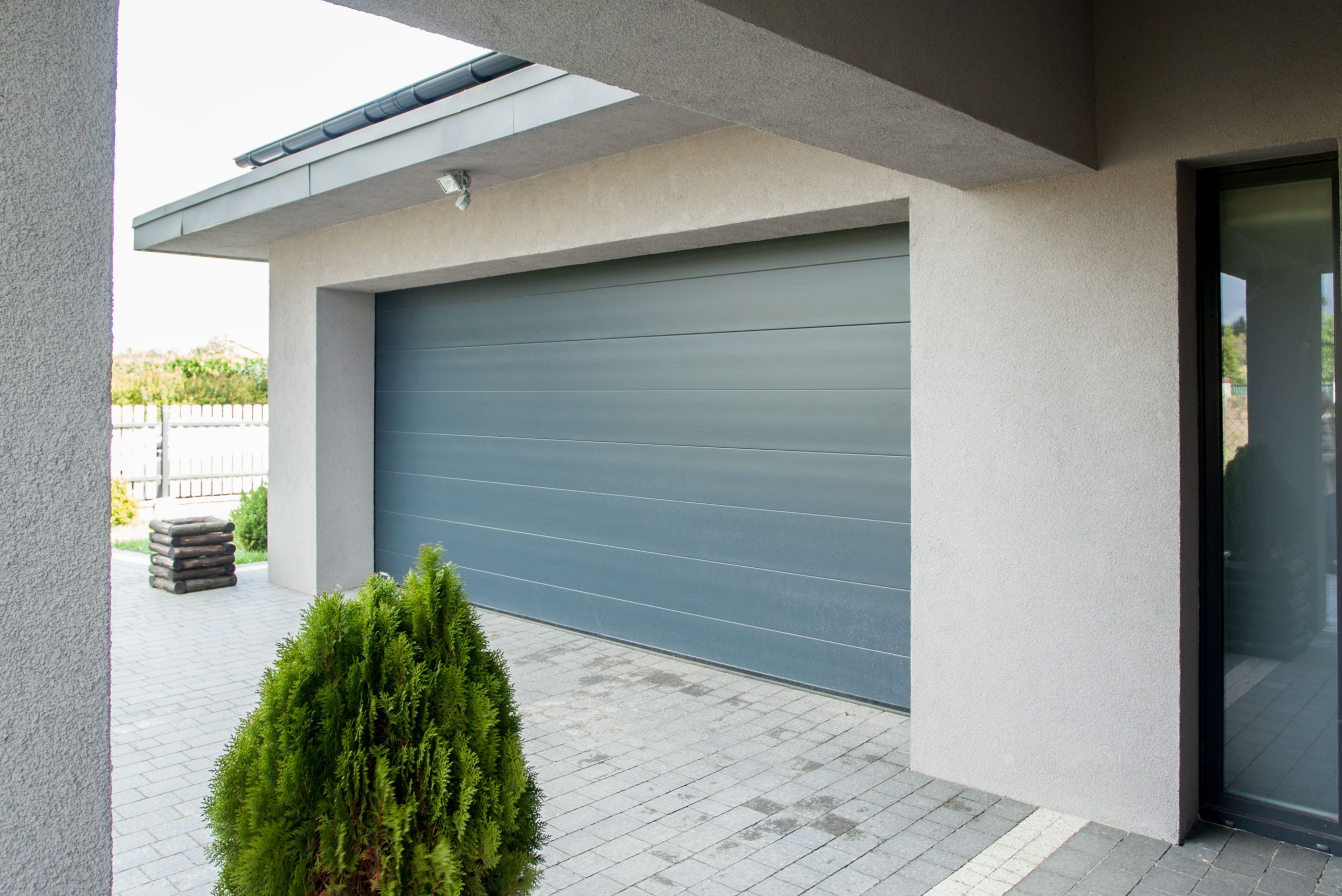 A black and white photo of a garage door